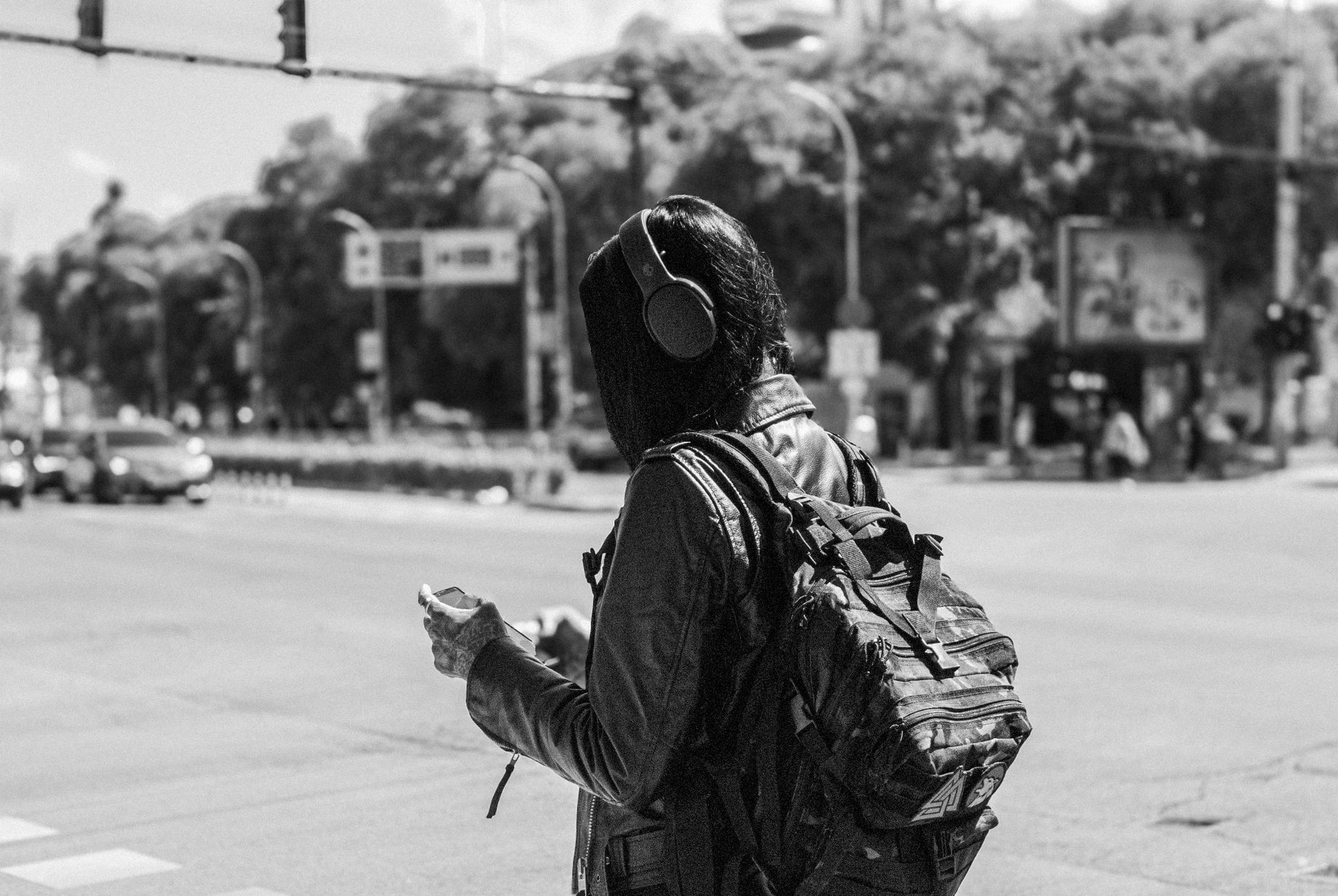 Listener with headphones on the go